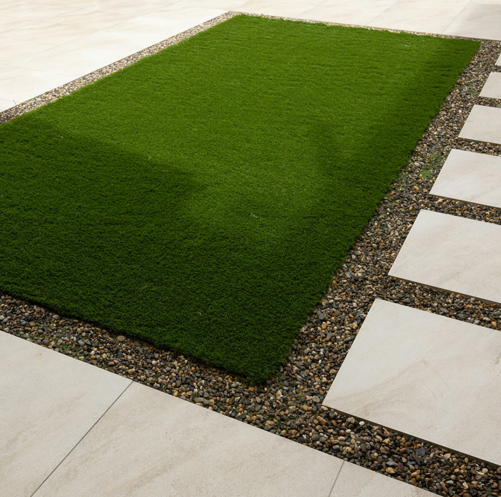 Patch of artificial turf installed in backyard