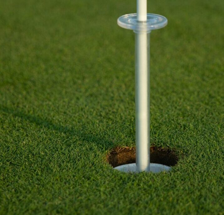 close up of hole with artificial turf